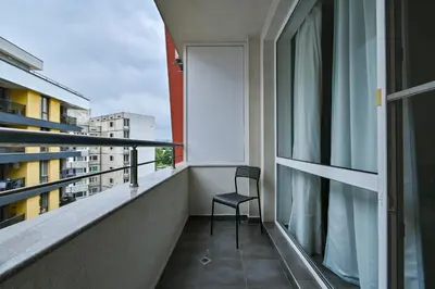 a chair sitting on the balcony of a building at Studio 19 in Sofia