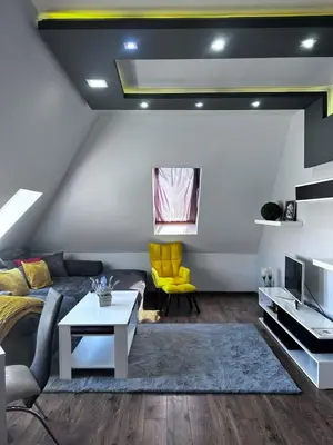 a living room with a couch and a table at кристален въздух in Sofia