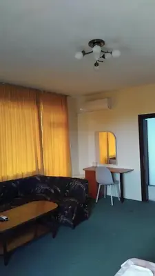 a living room with a couch and a table at Интернационал in Kulata