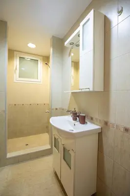 a bathroom with a sink and a shower at Bright 1BDR Apartment in Top Center in Sofia