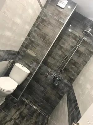 a bathroom with a toilet and a shower at Predela 1 Bansko Apartment in Bansko