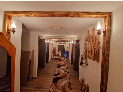 a hallway of a house with a long hallway sidx sidx sidx at Вила Леска in Leska