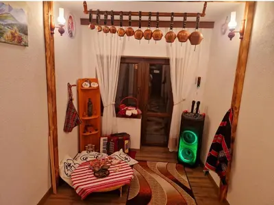 a room with a mirror and a table and a door at Вила Леска in Leska