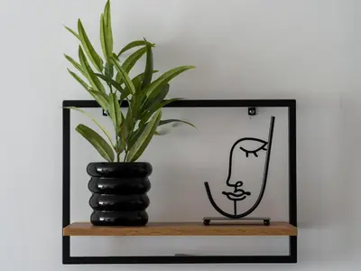 a plant in a vase on a shelf at Vertigo 2 Modern 2-Bedroom Apartment with Parking & Vitosha View in Sofia