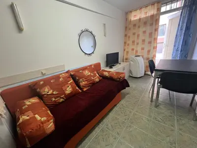 a living room with a couch and a table at Cheep&Free on the Ground floor and Pets friendly in Sofia