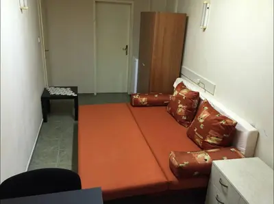 a living room with a couch and a table at Cheep&Free on the Ground floor and Pets friendly in Sofia