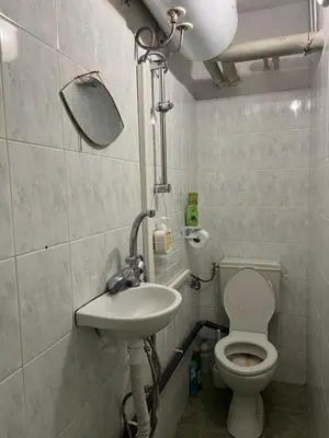a small bathroom with a toilet and a sink at Cheep&Free on the Ground floor and Pets friendly in Sofia