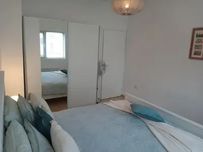 a bedroom with a bed and a large mirror at Cathedral Central Apartment Top Location in Sofia