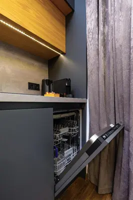 a dishwasher in a kitchen next to a curtain at Happy People Plovdiv - Grey 1-BD Apartment by Flat Mаnager in Plovdiv