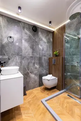 a bathroom with a toilet and a sink and a shower at Happy People Plovdiv - Grey 1-BD Apartment by Flat Mаnager in Plovdiv