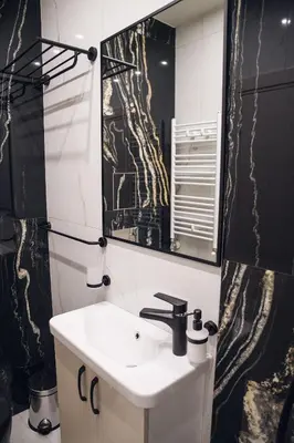 a bathroom with a sink and a mirror at Luxurious House with Deluxe rooms & Free Secured Parking in Sofia