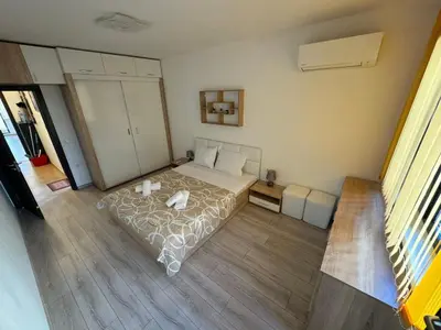 a bedroom with a bed in a room at Апартамент Клисура in Plovdiv