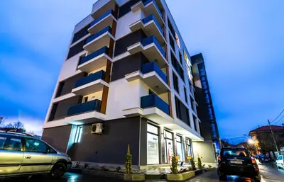 a tall building with blue and white at Apartmenthaus Oborishte - 27 in Panagyurishte