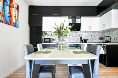 a kitchen with a white table and chairs at Prime Spot for 5 Full Kitchen Wi-Fi AC in Sofia