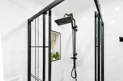 a shower in a bathroom with a mirror at Prime Spot for 5 Full Kitchen Wi-Fi AC in Sofia