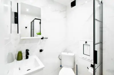 a white bathroom with a sink and a toilet at Prime Spot for 5 Full Kitchen Wi-Fi AC in Sofia