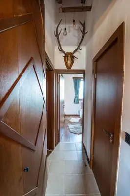 a hallway of a home with a door and a room at The Chalet 2 Bedrooms Paradise in Bansko