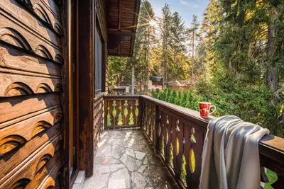 a balcony of a house with a wooden fence at Mountain Villa Borovets in Borovets