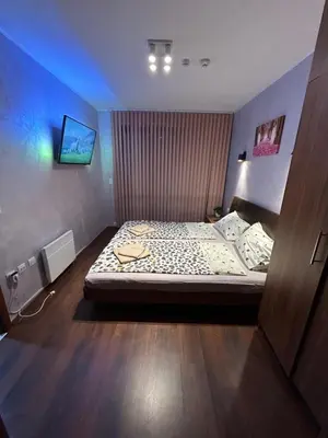 a bedroom with a bed in a room at 2-bedroom, 2-bathroom with fireplace and garden at Winslow Infinity in Bansko