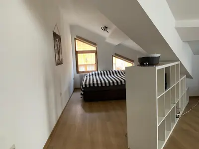 a bedroom with a bed in a attic at Mountain View in Razlog