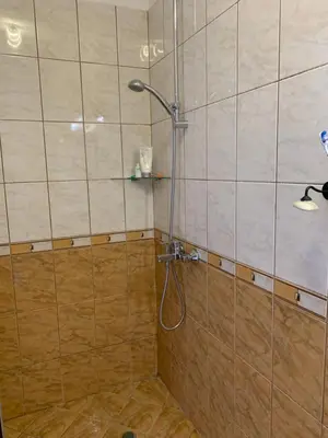 a bathroom with a shower with a glass door at Mountain View in Razlog