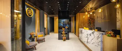 a lobby of a store with chairs and a counter at B1 Downtown Hotel, Sofia in Sofia