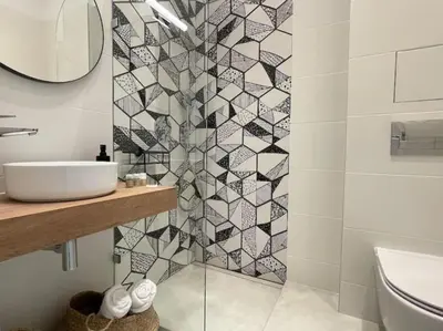a white bathroom with a sink and a mirror at Borisova Garden Skyline by Cosher in Sofia