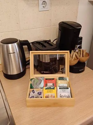 a wooden box on a counter next to a coffee pot at Cozy Studio in Semiramida Gardens - Borovets Hills 39 in Borovets