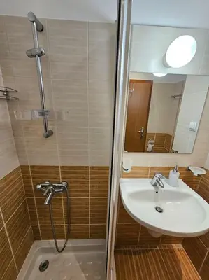 a bathroom with a shower and a sink at Cozy Studio in Semiramida Gardens - Borovets Hills 39 in Borovets