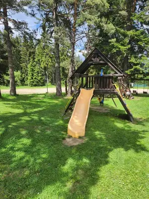 a playground with a slide in a park at Cozy Studio in Semiramida Gardens - Borovets Hills 39 in Borovets