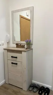 a bathroom with a vanity with a mirror and shoes at Paradise Park Apartment Central Sofia Gem in Sofia