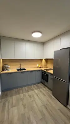 a large kitchen with a sink and a refrigerator at Paradise Park Apartment Central Sofia Gem in Sofia