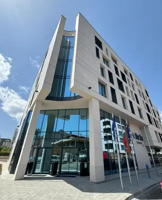 a large building with a lot of windows at Blue Star Luxury Hotel in Sofia