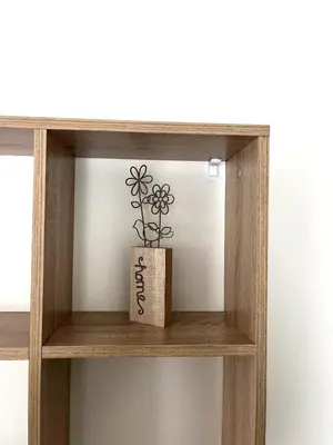 a wooden shelf with a plant on it at goHOME Plovdiv-apartments and studio in Plovdiv