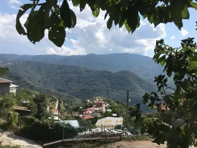 a view of a village in the mountains at Boutique house in Devin