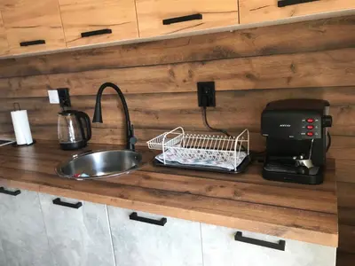 a kitchen counter with a sink and a coffee maker at Boutique house in Devin
