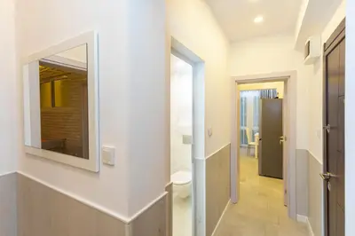 a hallway with a mirror on the wall at Central St Vitosha Apartment in Sofia