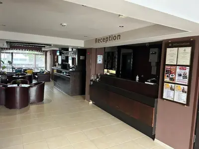 a restaurant with a counter and a restaurantacistacistacistacist at Dreamroom Bansko in Bansko