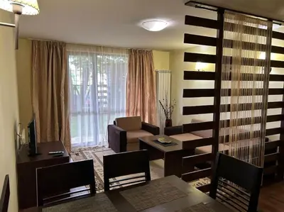 a living room with a couch and a table at Dreamroom Bansko in Bansko