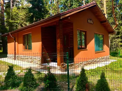 a small house with a fence in front of it at Villa Capricorn in Tsigov Chark
