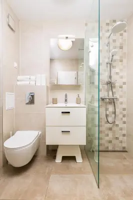 a bathroom with a toilet and a sink and a shower at Bright and Cozy 1BD Flat in Plovdiv with Parking by Flat Mаnager in Plovdiv