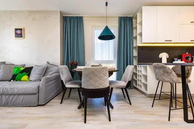 a living room with a couch and a table at Bright and Cozy 1BD Flat in Plovdiv with Parking by Flat Mаnager in Plovdiv