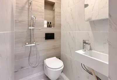 a bathroom with a shower and a toilet and a sink at 2 Private Suits - Art, Location, Quiet, Balconies in Sofia
