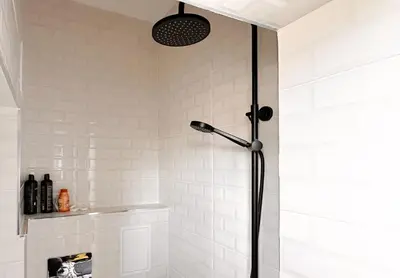 a shower in a bathroom with white tiles at 2 Private Suits - Art, Location, Quiet, Balconies in Sofia