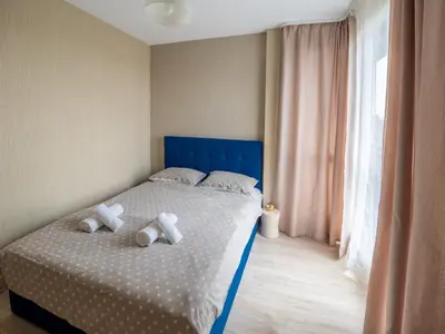 a bedroom with a bed with two stuffed animals on it at The Boulevard Luxury Apartment 2 in Sofia