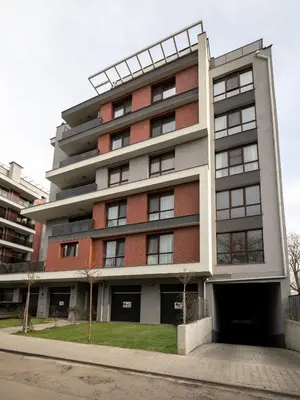 an apartment building with a red brick at The Boulevard Luxury Apartment 2 in Sofia