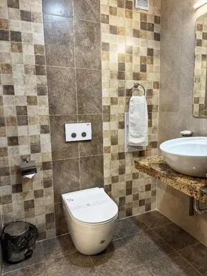 a bathroom with a toilet and a sink at City Plaza in Botevgrad