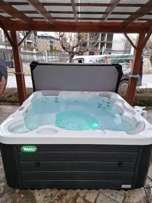 a hot tub sitting under a gazebo at Aspen Suites Luxury apartment A005 in Razlog