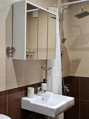 a bathroom with a sink and a mirror at Mladost Sofia, close to Metro Station and Center in Sofia