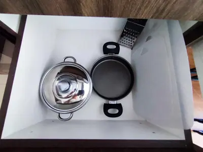 a white box with a pot and a laptop at Belvedere Holiday Club K106 in Bansko